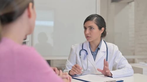 Close Up of Indian Female Doctor Listening Patients