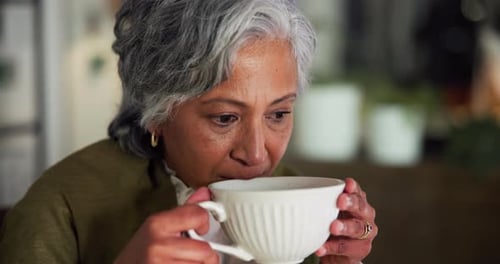 Coffee, smile and thinking with business woman in office for productivity, reflection and relax