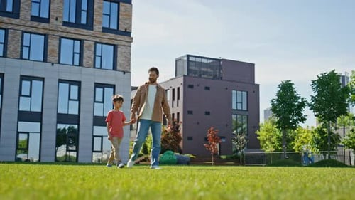 Happy Father Son Walking Sunshine Park Enjoying Holiday Boy Holding Man Talking