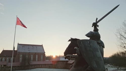 Bronze Horseman Statue By Castle Of Kaunas On Sunset