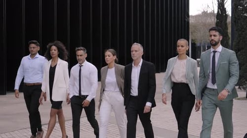 Large Group Diverse Business Serious People in Suits Stroll with Confidence Towards Financial Center