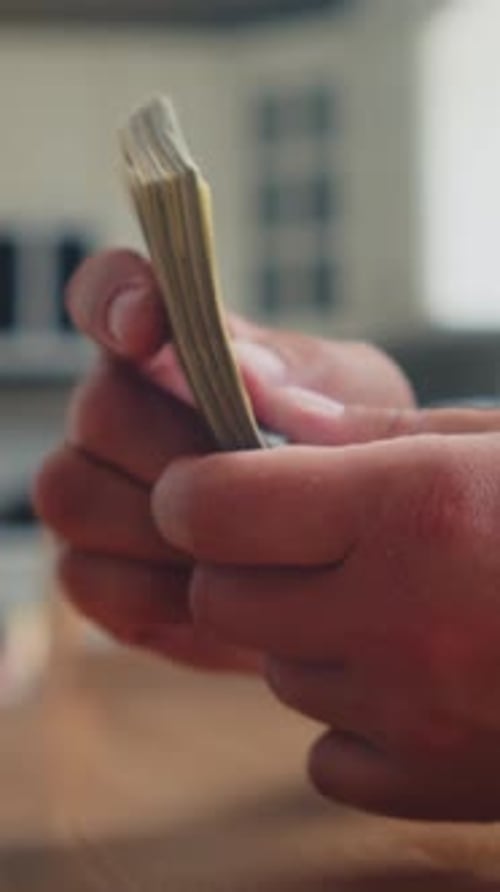 Close Up Of Man Counting Dollar Bills Vertical Video Wealth And Cash Payment Clip
