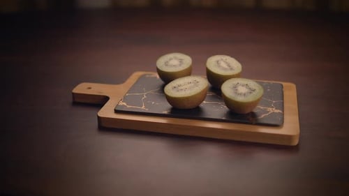 Halved Kiwi on Serving Board Still Life