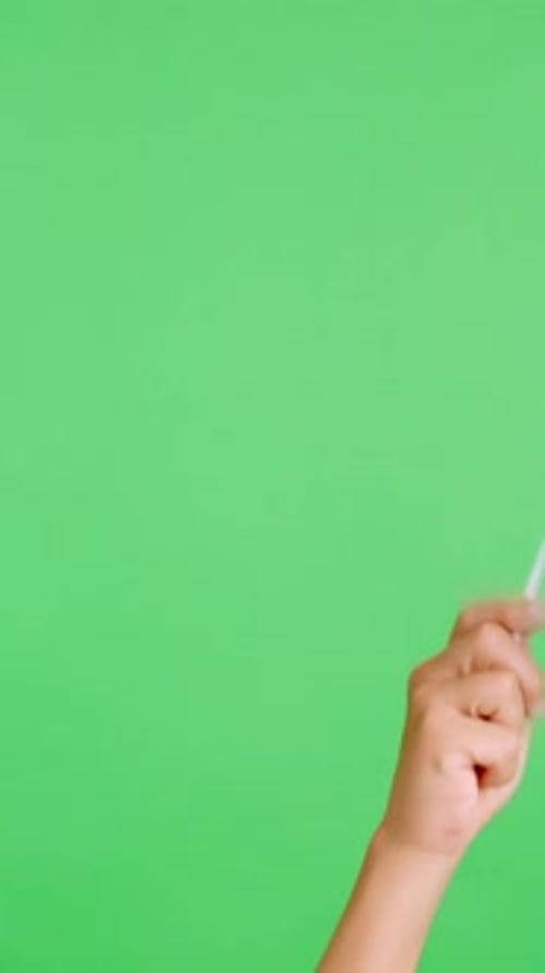 Hand Waving a Flag on Green Screen