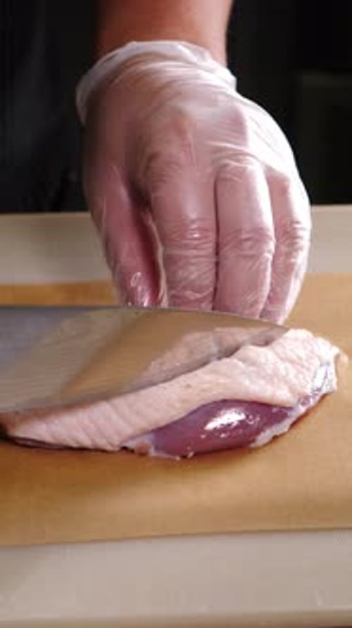 Chef Making Cuttings on Raw Duck Meat with Knife Restaurant Chef Slicing Raw Duck Breast Luxury