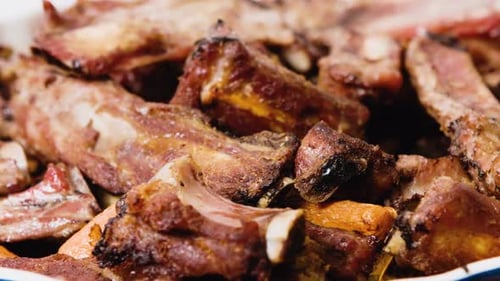 Juicy Grilled Ribs with Carrots in Platter