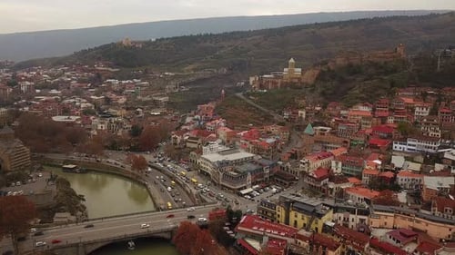 Car cross the river on the street in georgia and the landscape of mountain and hills with forest and