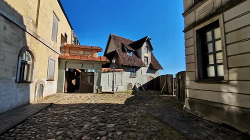 Typical european street view with cobbled roads and tiled roof house