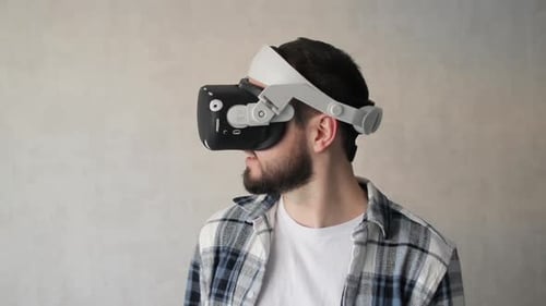Man Experiencing Virtual Reality Headset at Home