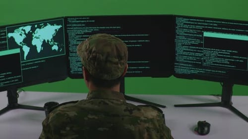 Asian Man Soldier Developer Using Computer To Write Code With Multiple Screens In Green Screen