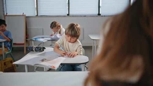 Small Schoolboy Writing Copybook at Lesson Smart Boy Learning Doing Class Work