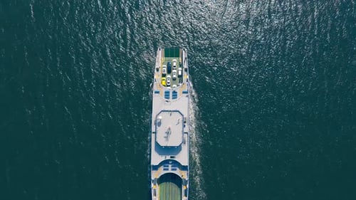 Aerial View on Passenger and Vehicle Car Ferry Boat Sailing in Sea