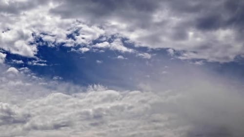 Clouds Moving Across Blue Sky During Daytime