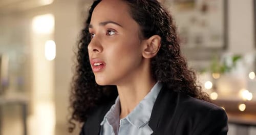 Stressed Woman Rubbing Her Face in an Office