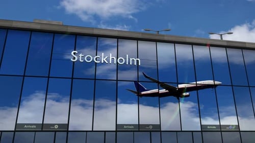 Airplane landing at Stockholm mirrored in terminal