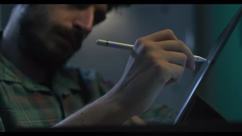 Fine Art artist using a Digital Tablet to paint his next work