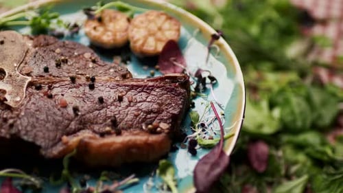 Delicious Grilled Steak with Garlic and Fresh Greens