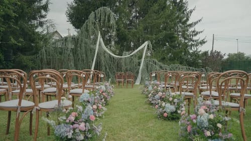 Empty Wedding Ceremony Site Outdoors on Green Lawn