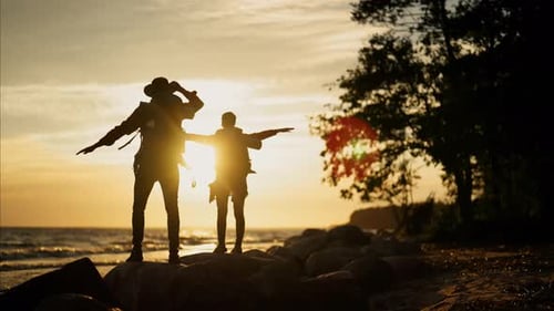 Happy Travelers on Shore of Sea Admiring Horizon Rear View Hiking in Nature Carefree People with