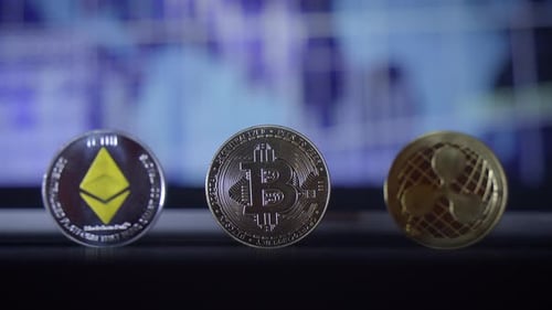 Close Up of Bitcoin, Ethereum, Ripple Coins