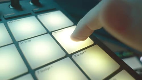 DJ Presses Key on Console for Laser Show Stroboscope Effect