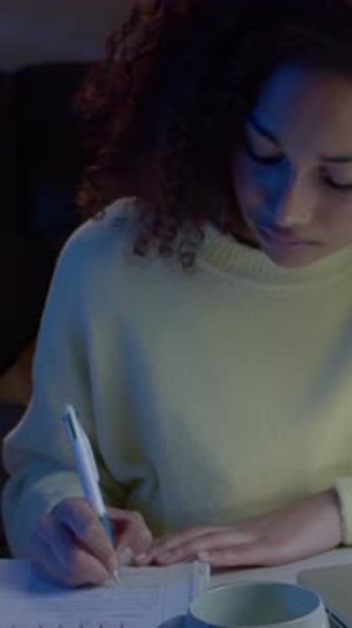 Vertical Video Teenager Female Student Studying with a Laptop at Home