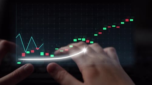 Hands Using Digital Tablet to Analyze Stock Market Graph with Green and Red Candlestick Indicators i