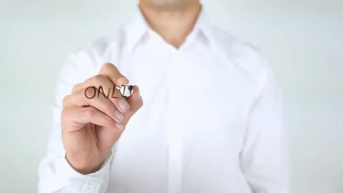 Man Writes Online Marketing Strategy on Glass