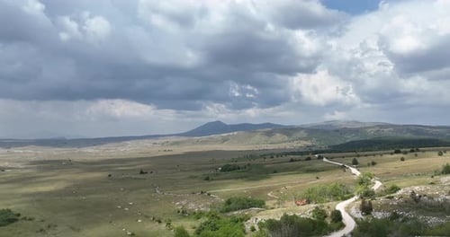 Aerial View of Road in Beautiful Green Fields at Beautiful Sunny Day in Summer