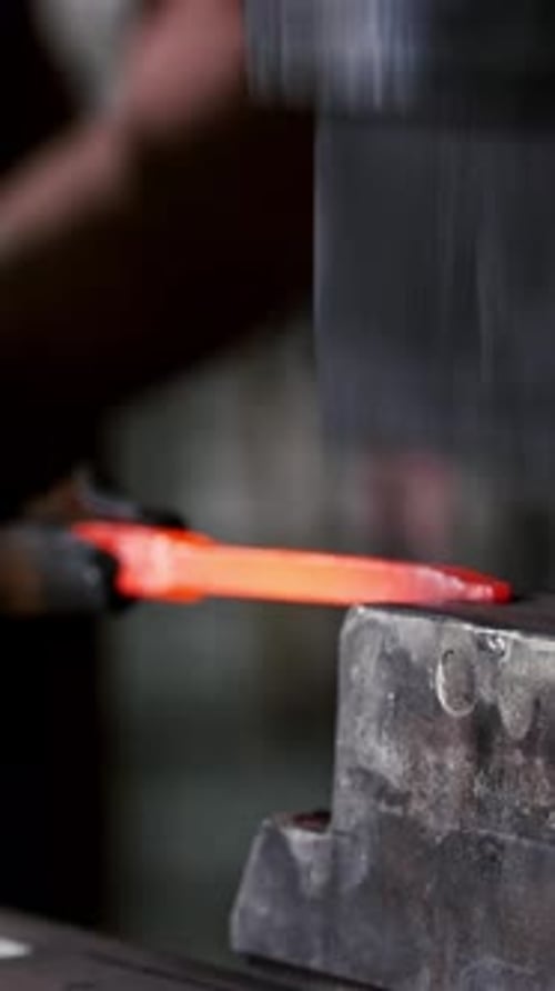 Metal Forging: Blacksmith Shaping Hot Steel with Powerhammer