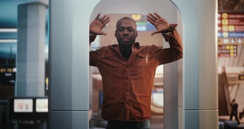Man Going Through Security Check in Airport