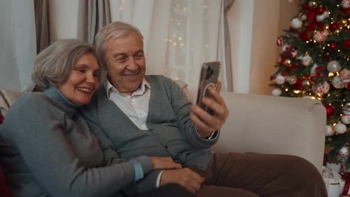 Senior Couple Video Calling at Christmas Time