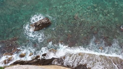 Aerial View Drone Camera Top Down of Seashore Rocks in Ocean Amazing Sea Waves Crashing on Rocks