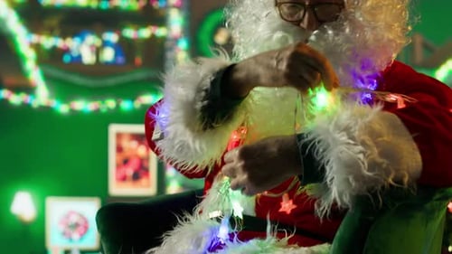 Santa Claus Tangling with Christmas Lights in Living Room