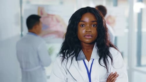 Woman in Medical Coat Standing in Hospital