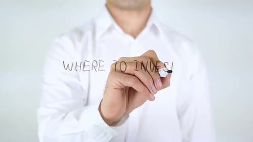 Man Writes Question Where to Invest on Glass