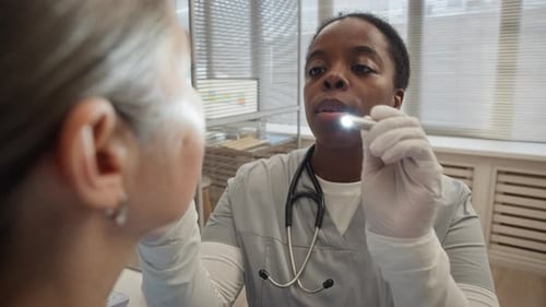 Doctor Checking Patient Eye Health in Modern Clinic