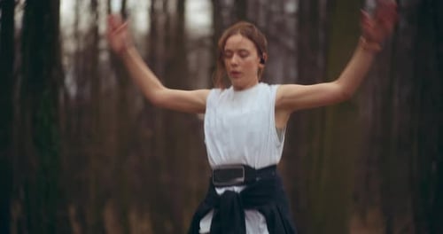 Female Athlete Jumping While Doing Workout in Garden
