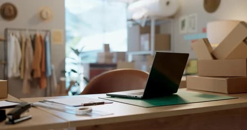 Empty office in shop, boxes or laptop for e commerce, small business order or inventory in startup