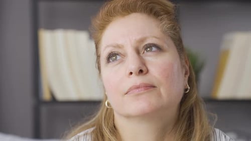 Woman Looking Away Thoughtfully in a Close Up Shot