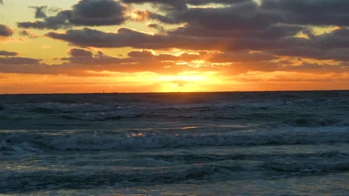 Ocean Sunset Landscape with Soft Evening Sea Water Waves Crushing on Sandy Beach