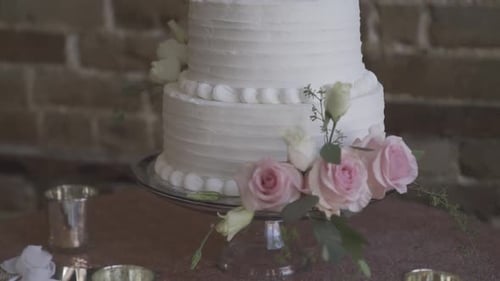 Ornate Wedding Cake With Buttercream Frosting and Roses