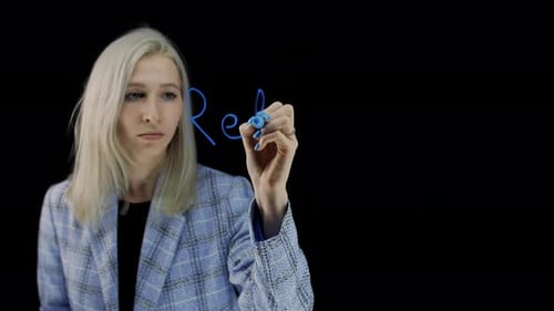 Relay Chain a Word Written in Blue Marker on a Black Background A Girl Writes Words on a Transparent