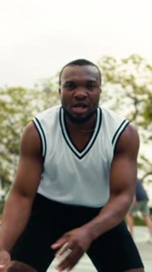Muscular Man Playing Basketball on Outdoor Court