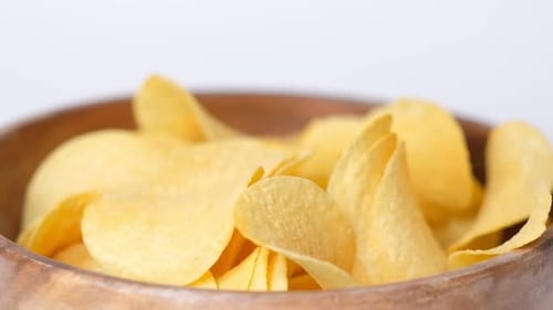 Potato Chips Bowl on White Background Close Up Hand of Female That Take Chips From Bowl Closeup Slow