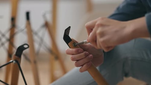 Chair Assembly Using Screwdriver in Home Setting