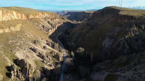 Breathtaking Canyon Vista With Rocky Cliffs and Winding Road