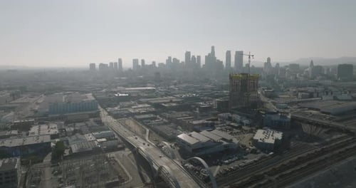 a city with a bridge and a large city in the background