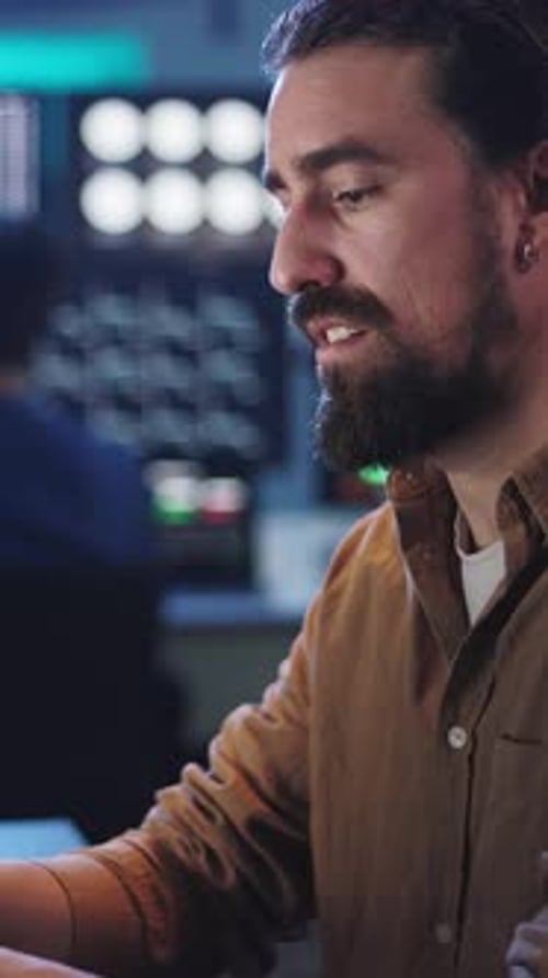 Young Stock Trader Businessman Working on Laptop in Dark Office