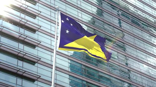 Tokelau Flag Waving in Sunlight Against Modern Building